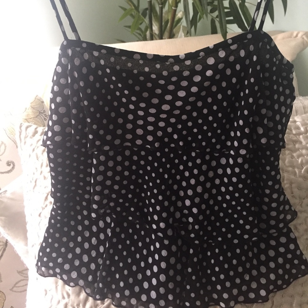 100% silk.Dress it up with a blazer/ pair of jeans